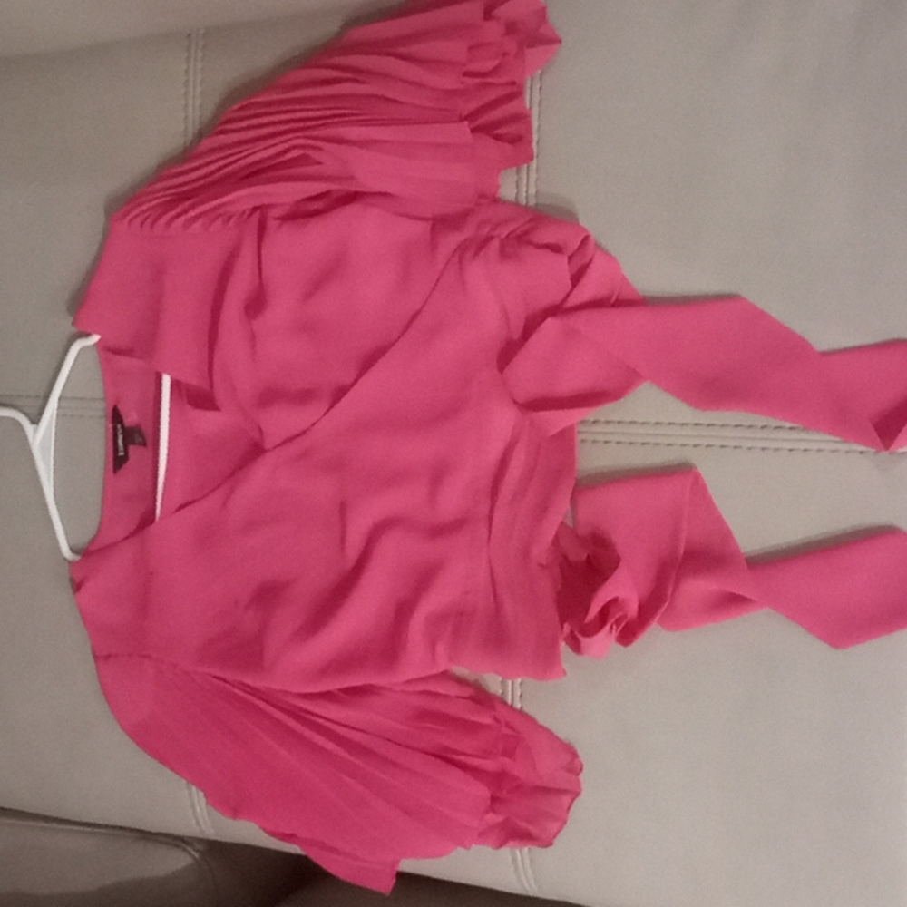 Pink top semi-see through.  Able to tie around .